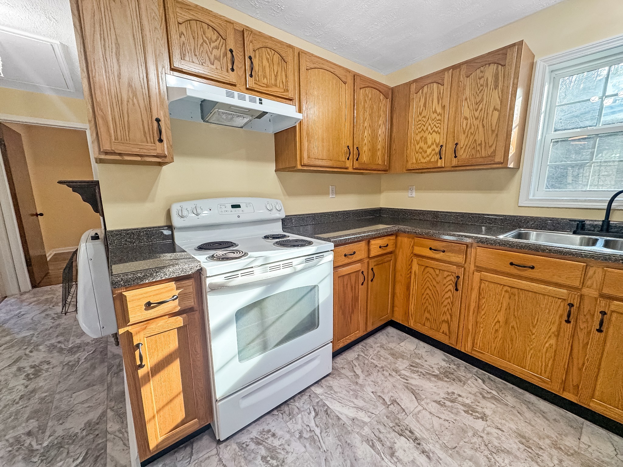 608 Big Rock Road Big Rock, TN 37023 - Photo 6 of 15 a kitchen with a stove sink and cabinets