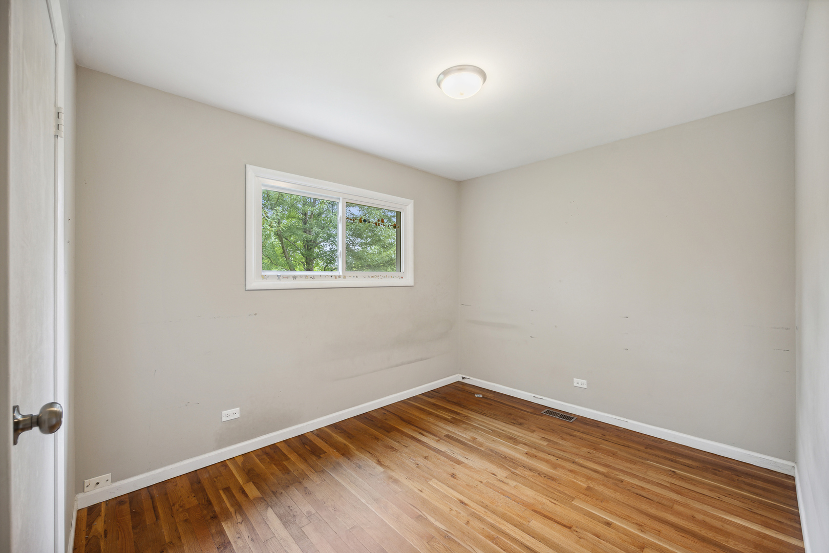 660 Alcoa Lane Hoffman Estates, IL 60169 - Photo 24 of 33 a view of empty room with wooden floor and fan