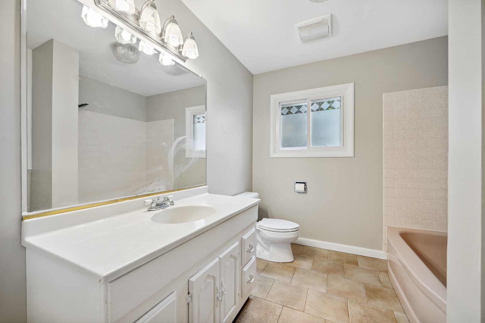 660 Alcoa Lane Hoffman Estates, IL 60169 - Photo 25 of 33 a bathroom with a sink a toilet and a mirror