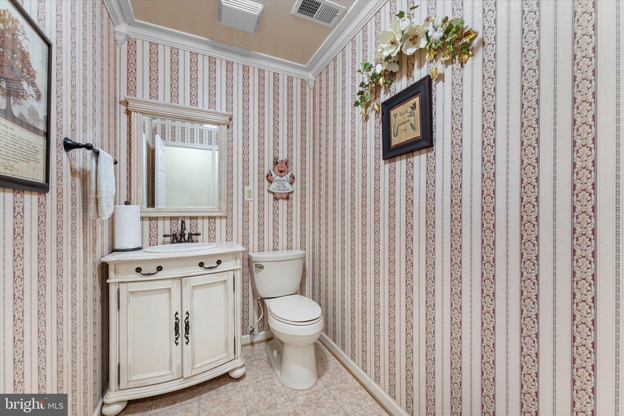 14917 Compton Road Centreville, VA 20121 - Photo 13 of 42 a bathroom with a toilet a sink and a mirror