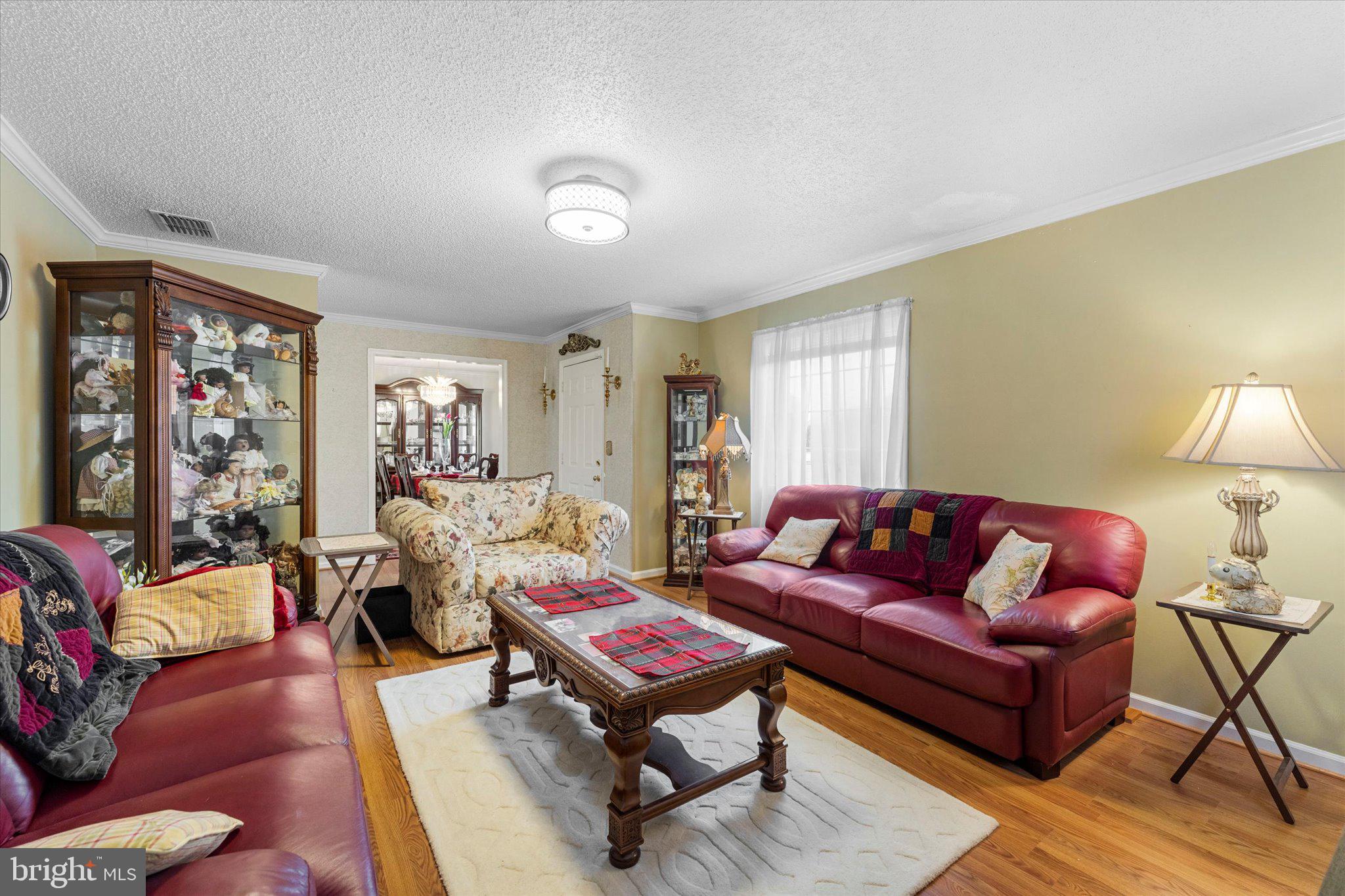 14917 Compton Road Centreville, VA 20121 - Photo 17 of 42 a living room with furniture a rug and a lamp