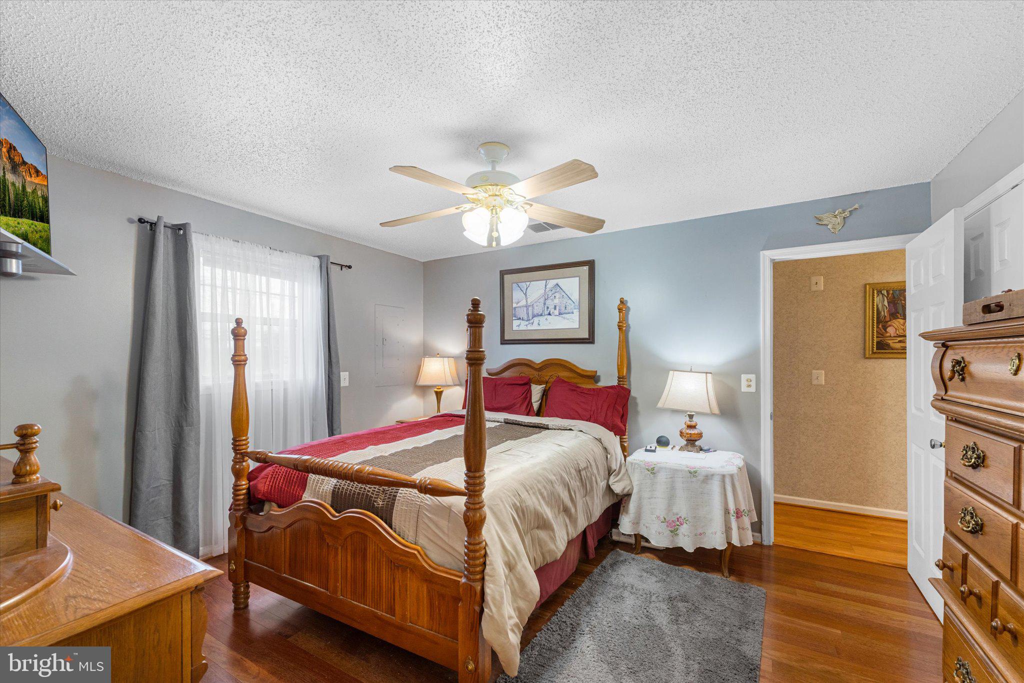 14917 Compton Road Centreville, VA 20121 - Photo 20 of 42 a bedroom with a bed and a chandelier