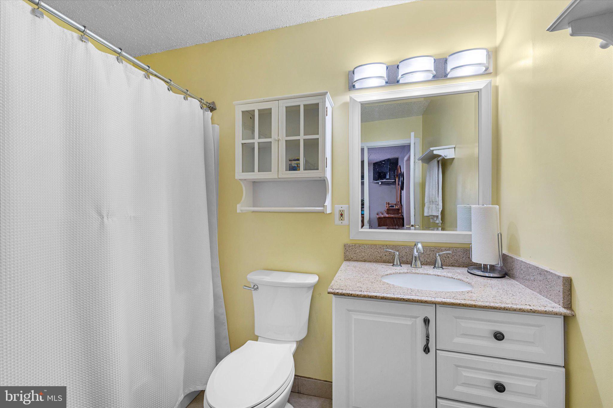 14917 Compton Road Centreville, VA 20121 - Photo 22 of 42 a bathroom with a sink a toilet and mirror