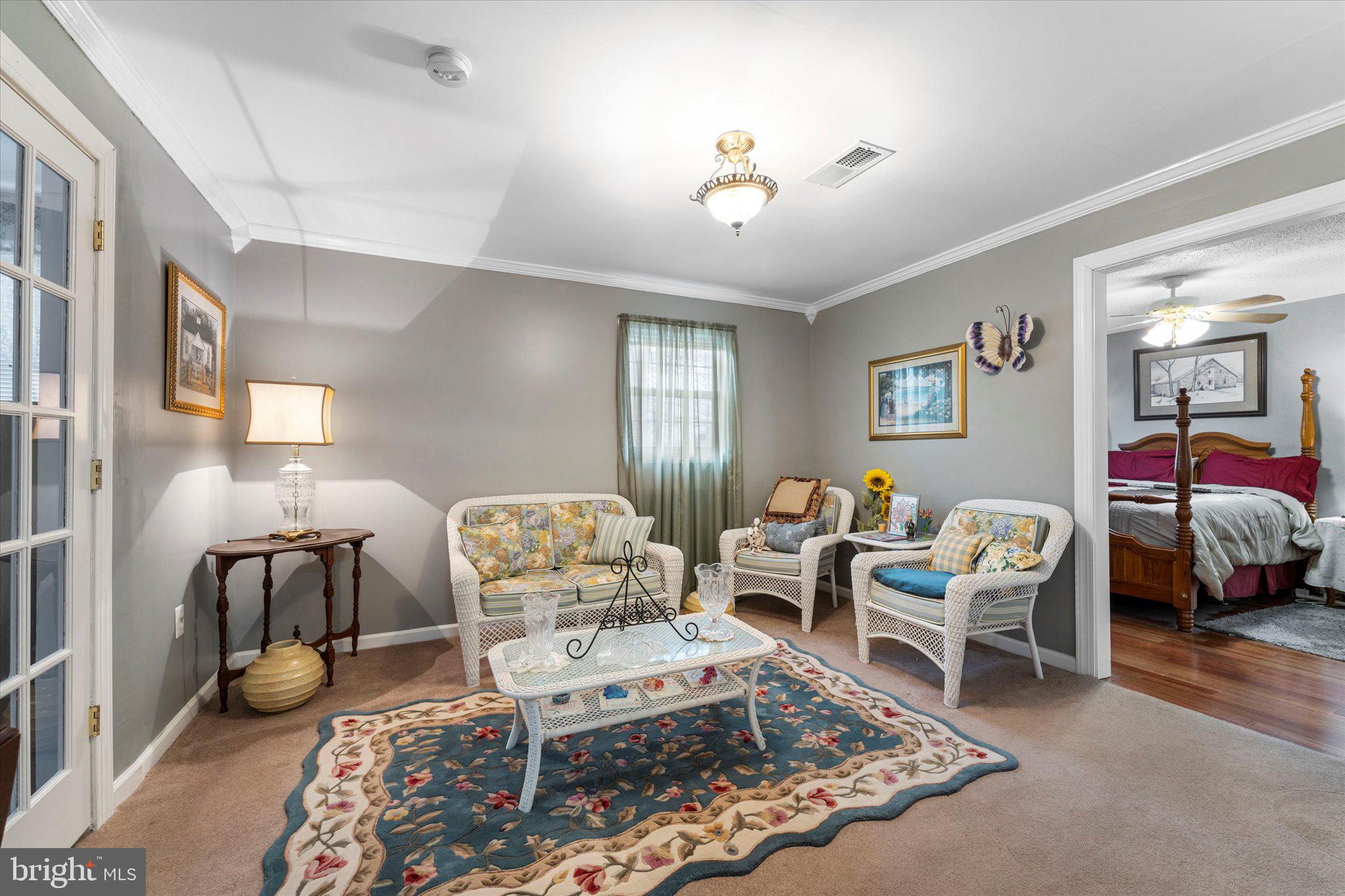 14917 Compton Road Centreville, VA 20121 - Photo 23 of 42 a living room with furniture and a chandelier