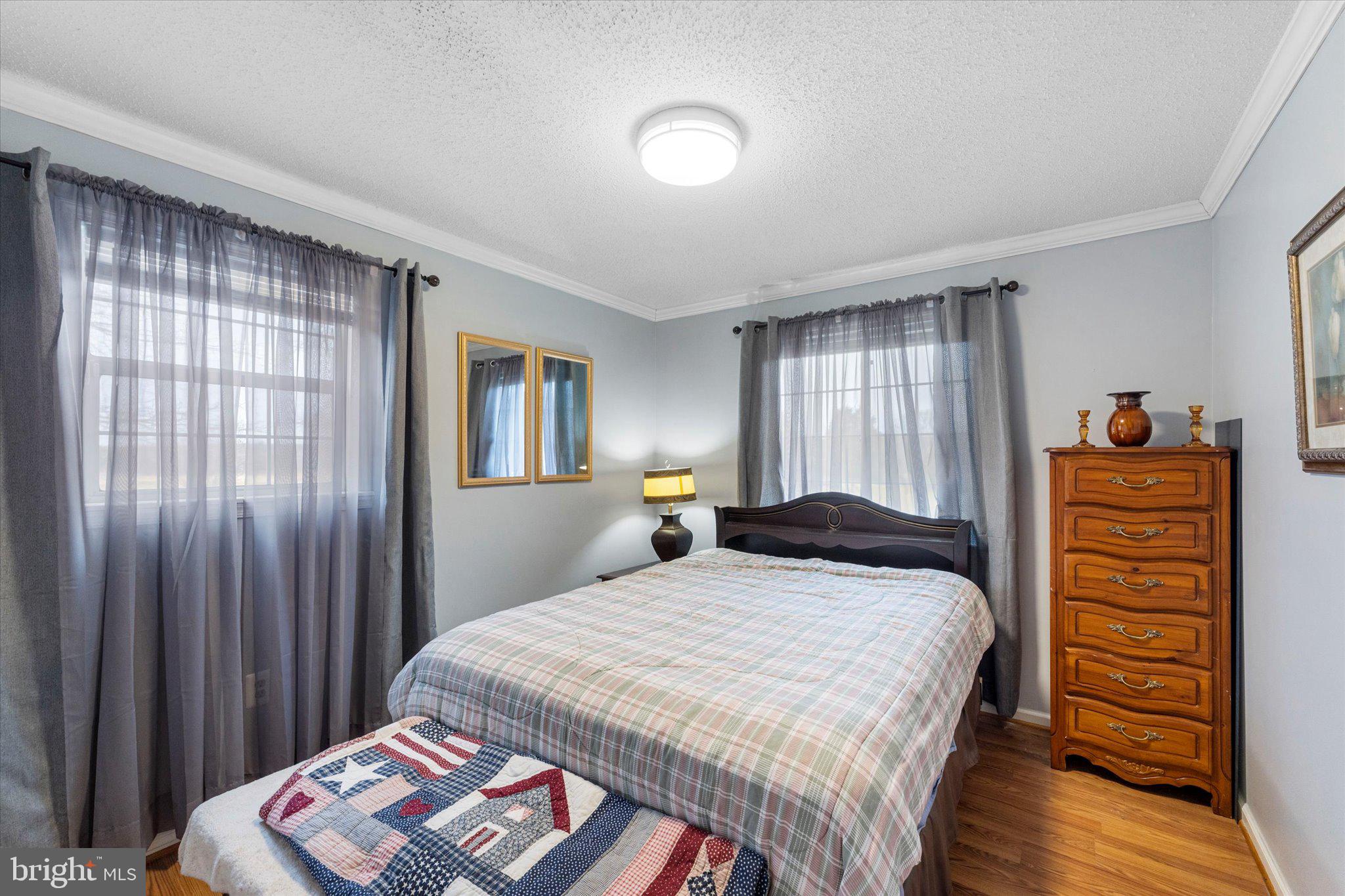 14917 Compton Road Centreville, VA 20121 - Photo 26 of 42 a bedroom with a bed and a dresser