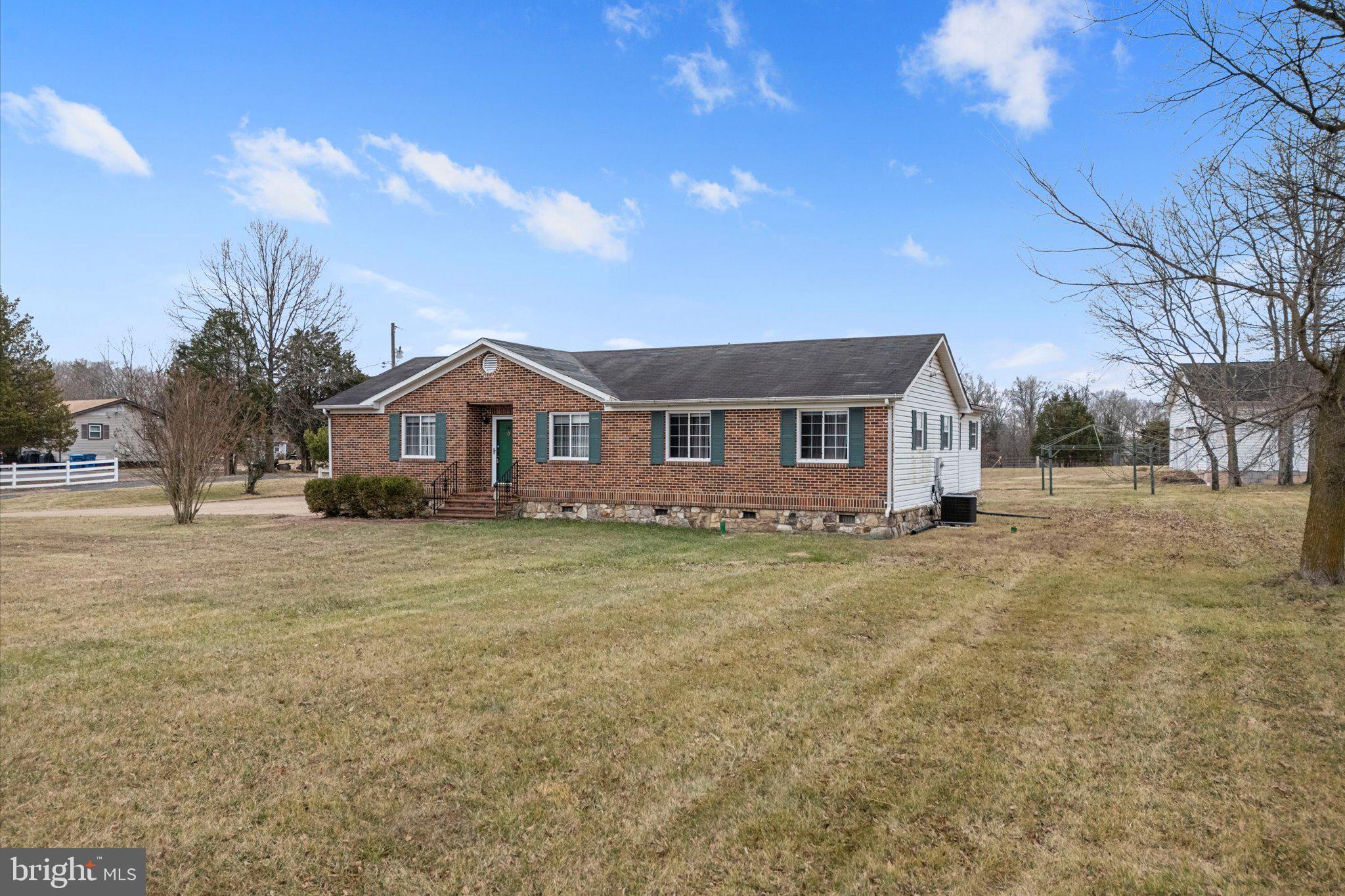 14917 Compton Road Centreville, VA 20121 - Photo 3 of 42 a front view of a house with a yard