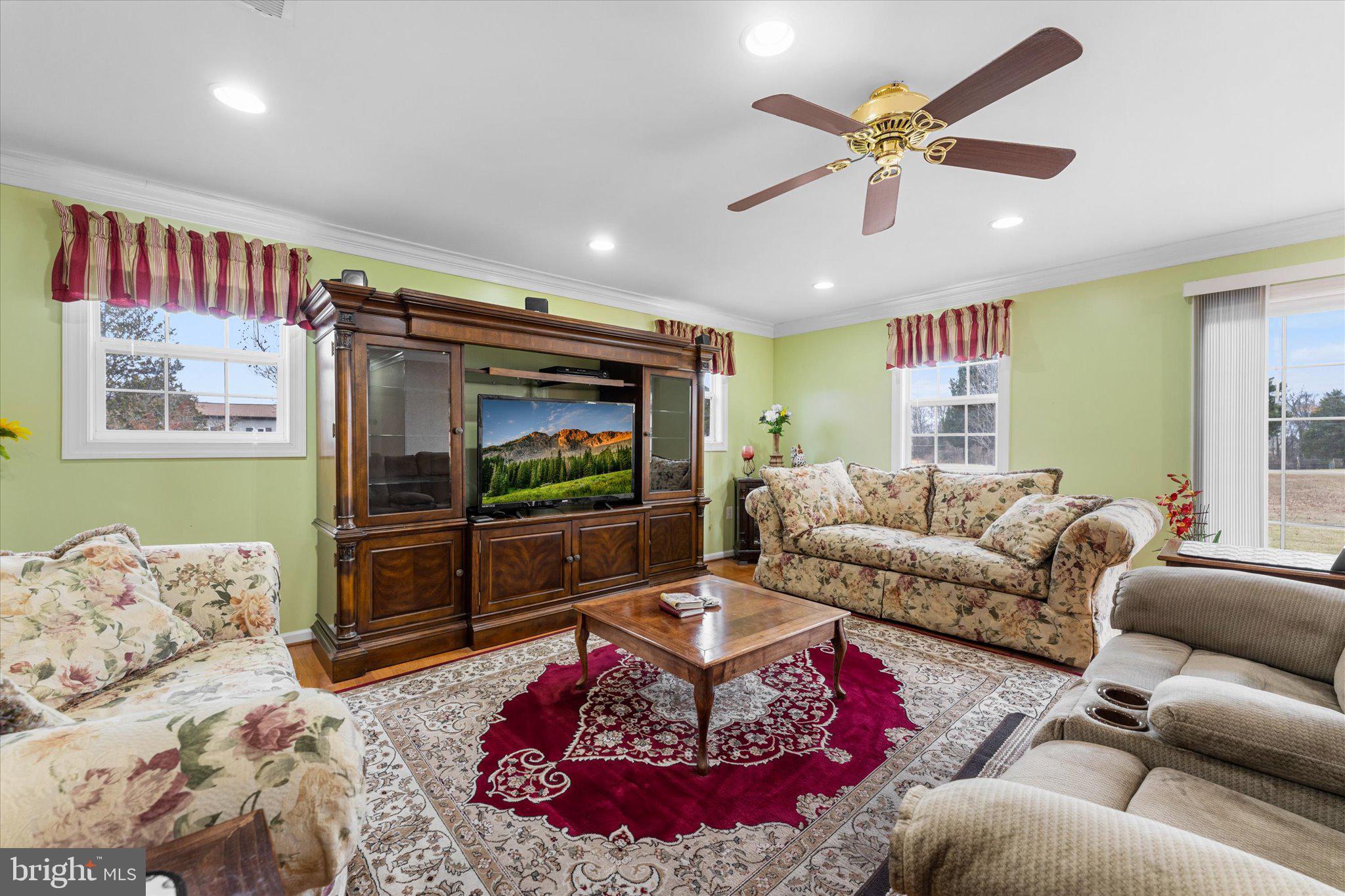 14917 Compton Road Centreville, VA 20121 - Photo 10 of 42 a living room with furniture and a flat screen tv