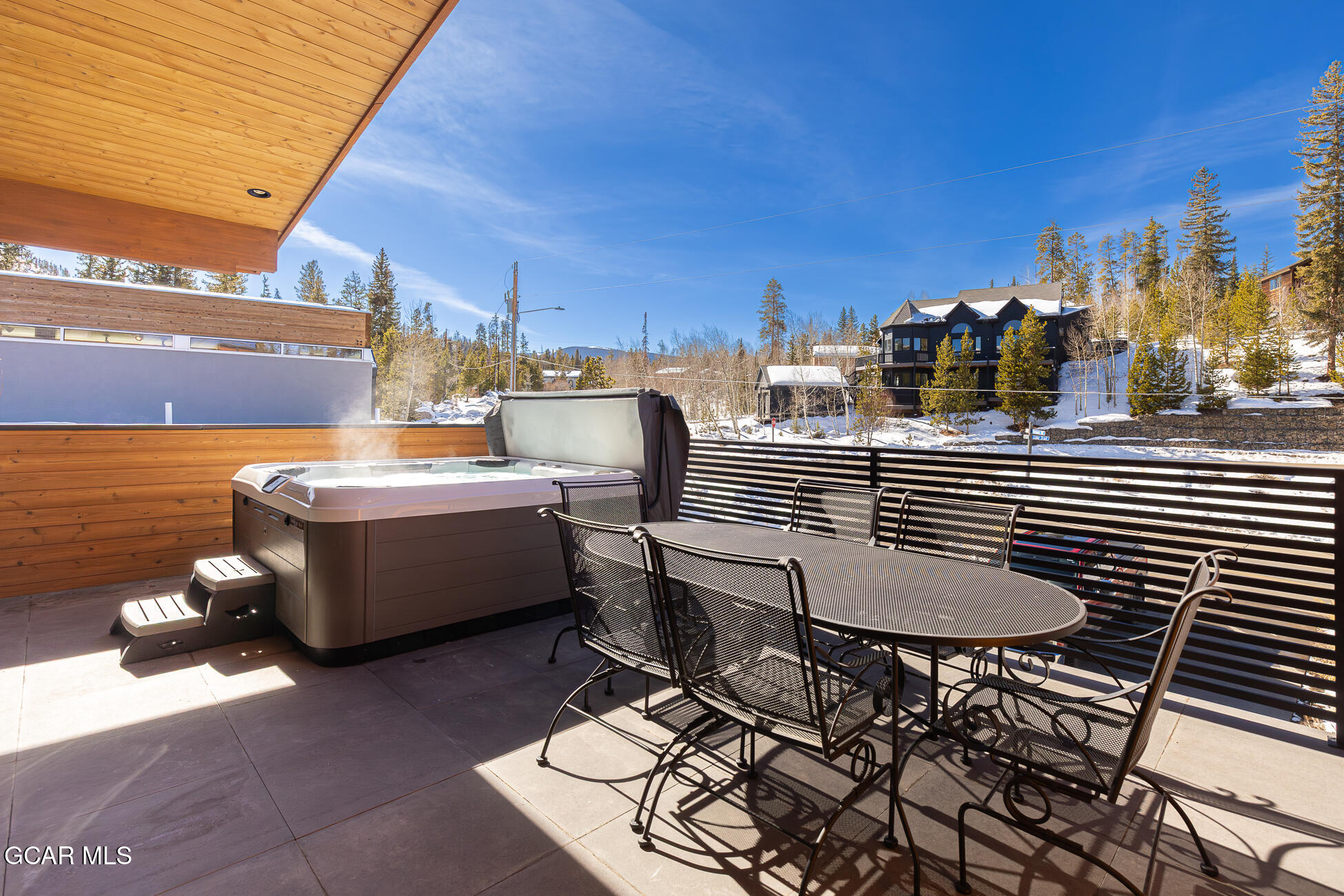 684 Vasquez Road Winter Park, CO 80482 - Photo 32 of 45 a view of a patio with table and chairs and potted plants