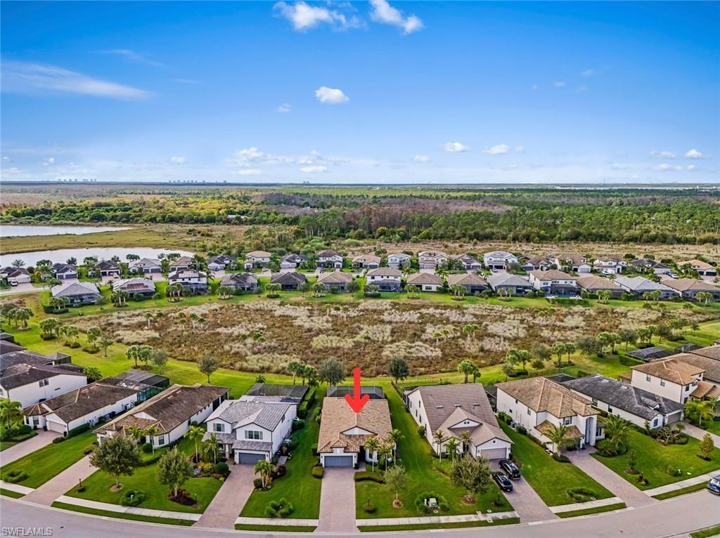 19902 Beverly Park Road Estero, FL 33928 - Photo 26 of 47 Aerial perspective of suburban area with a large body of water
