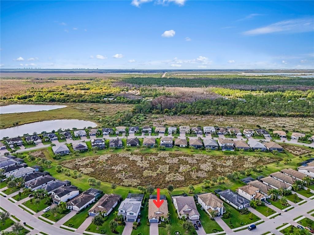 19902 Beverly Park Road Estero, FL 33928 - Photo 29 of 47 Aerial overview of property's location featuring nearby suburban area and a large body of water