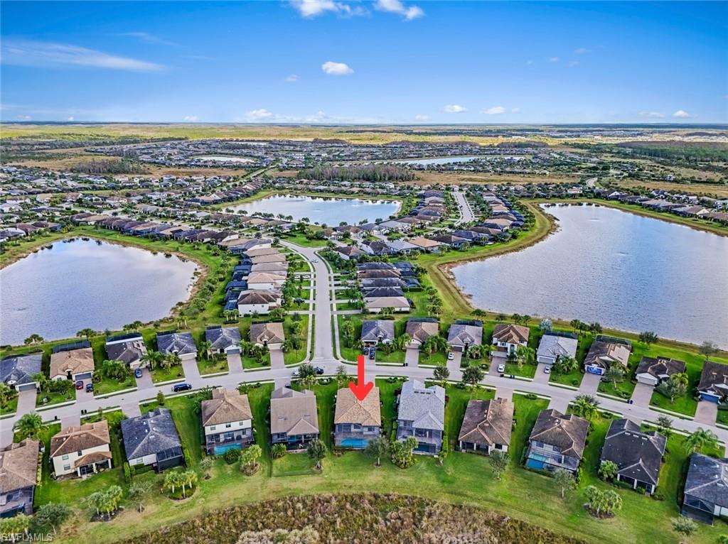 19902 Beverly Park Road Estero, FL 33928 - Photo 30 of 47 Aerial overview of property's location with nearby suburban area and a large body of water