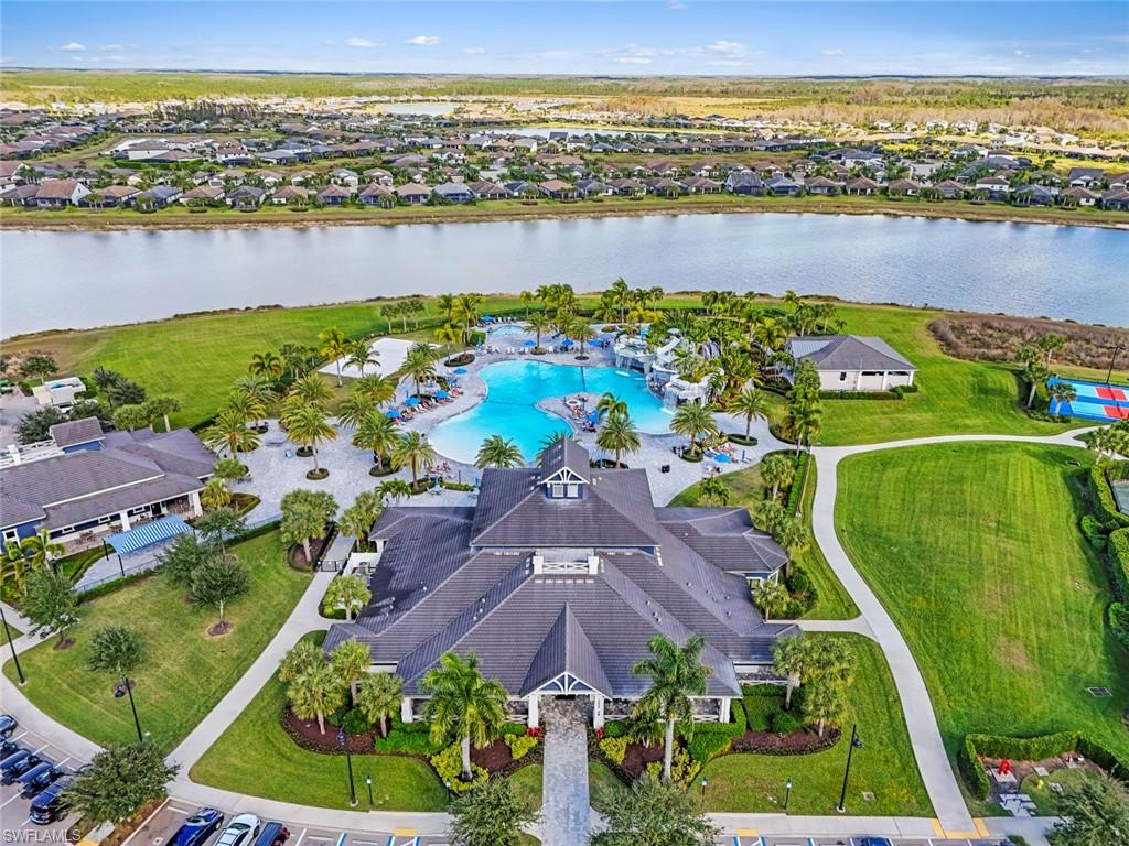 19902 Beverly Park Road Estero, FL 33928 - Photo 31 of 47 Aerial perspective of suburban area with a large body of water and a pool area