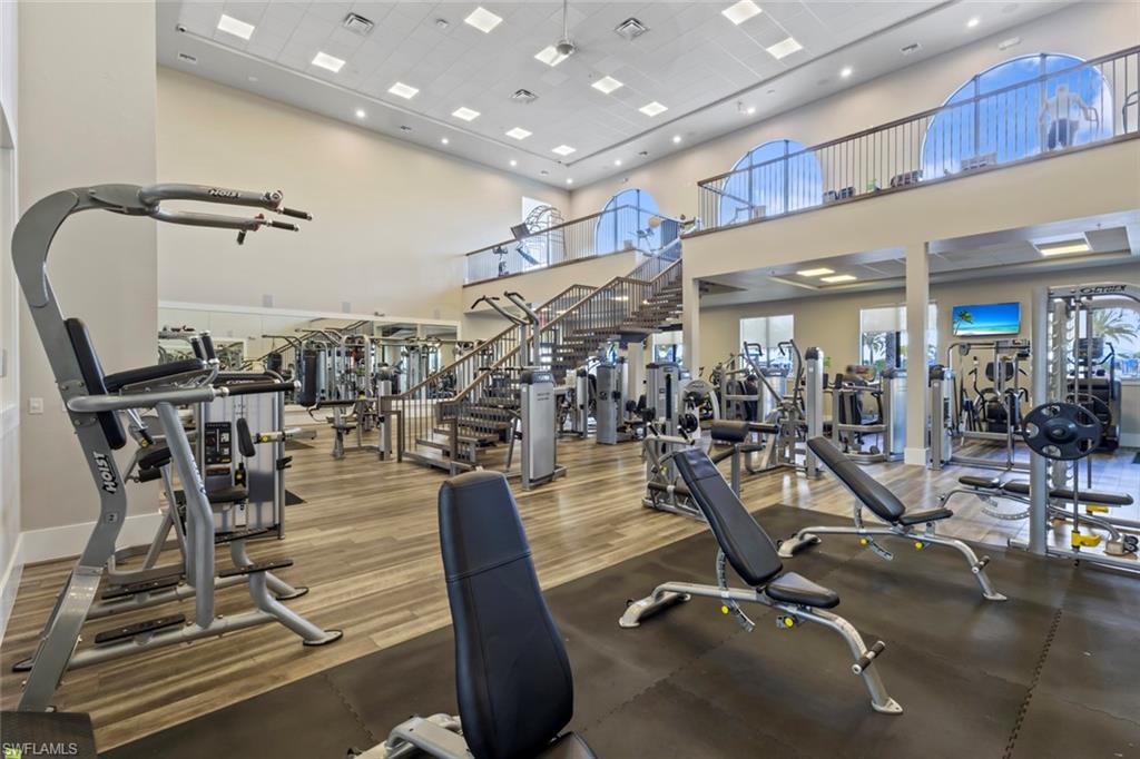 19902 Beverly Park Road Estero, FL 33928 - Photo 41 of 47 Exercise room featuring a high ceiling