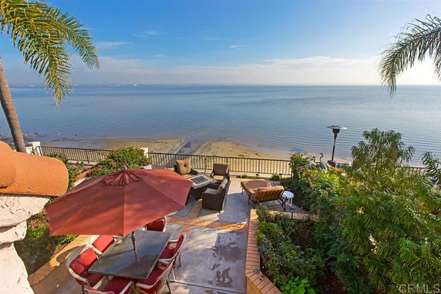 an outdoor space with furniture and umbrella