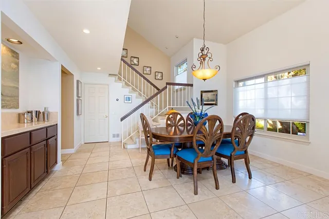 a dining room with furniture and window