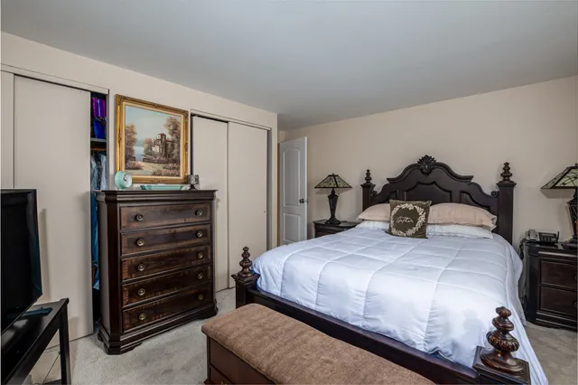 a bedroom with a bed and furniture