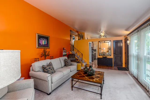 a living room with furniture and a rug