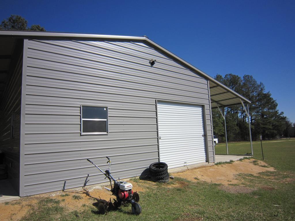 734 Avera Road Roberta, GA 31078 - Photo 14 of 17 a view of a house with a backyard