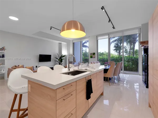 a view of a dining room with a table and chairs