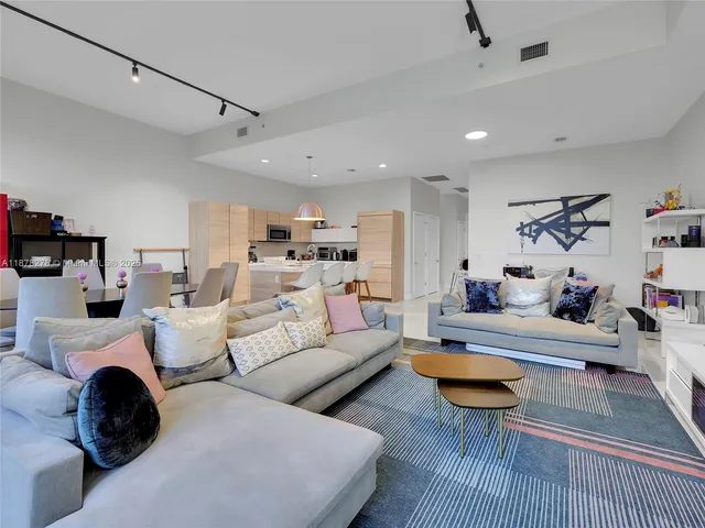 a living room with furniture and a table