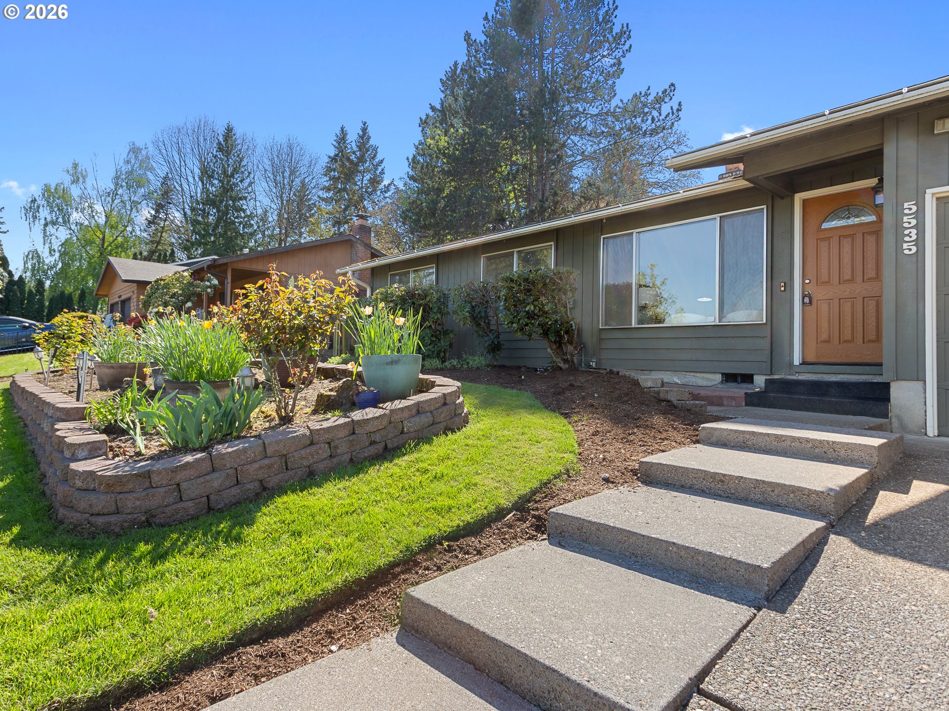 a front view of a house with garden