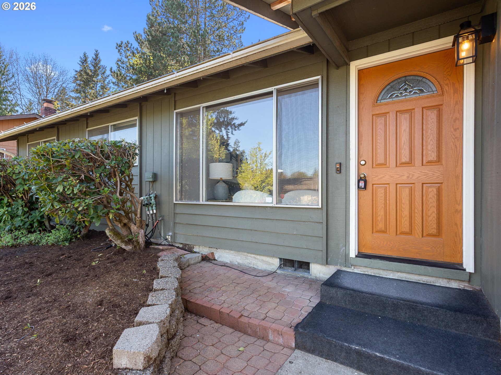 5535 Southwest 142nd Avenue Beaverton, OR 97005 - Photo 2 of 45 a front view of a house with garden