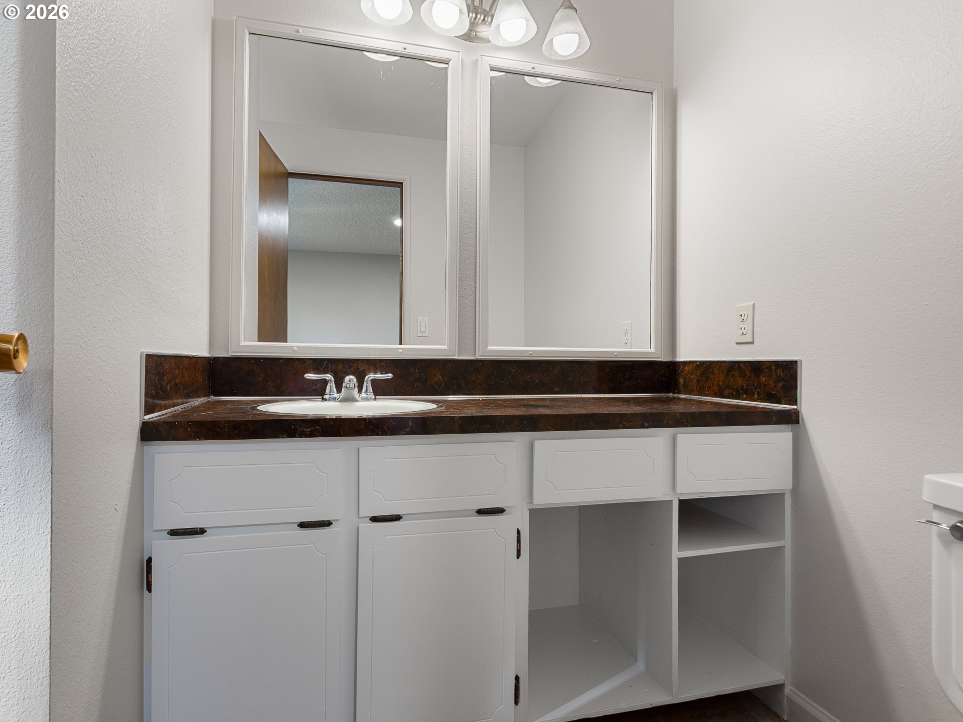 5535 Southwest 142nd Avenue Beaverton, OR 97005 - Photo 31 of 45 a bathroom with a sink and mirror