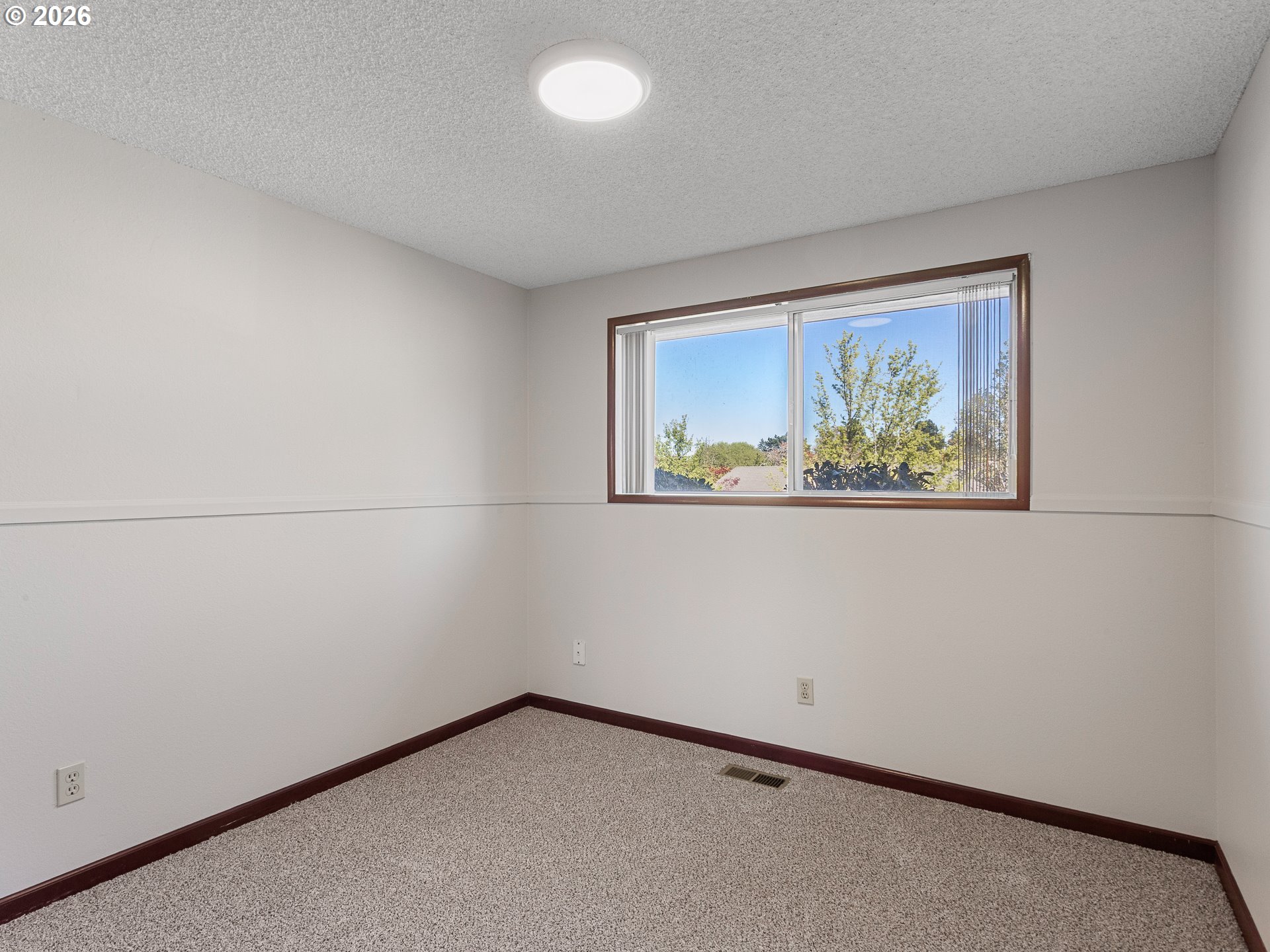 5535 Southwest 142nd Avenue Beaverton, OR 97005 - Photo 32 of 45 an empty room with a window
