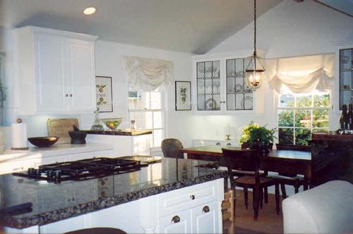 2324 State Street Santa Barbara, CA 93105 - Photo 4 of 9 a kitchen with granite countertop a stove a sink a dining table and chairs