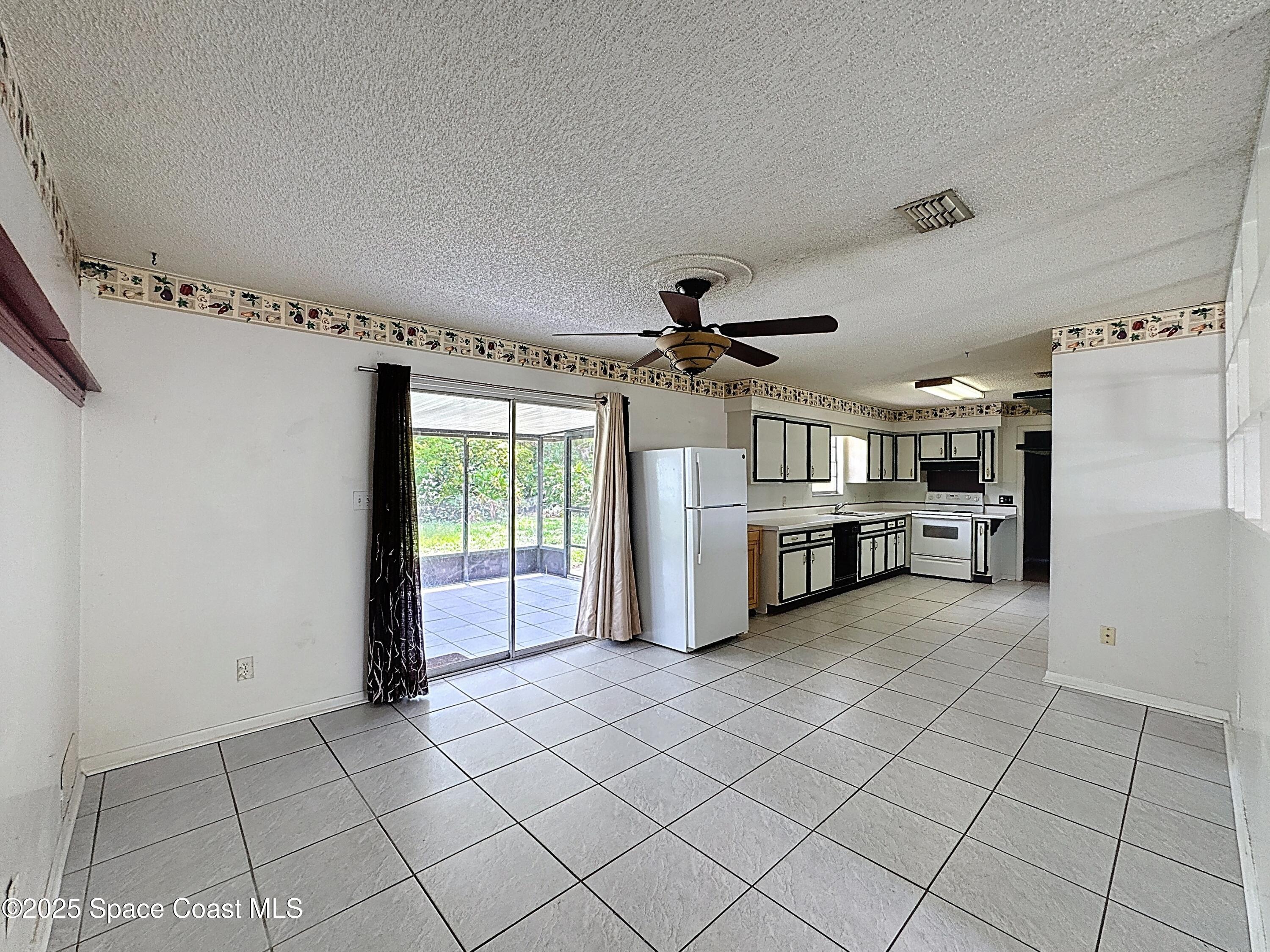 4865 Bridge Road Cocoa, FL 32927 - Photo 6 of 34 Dining Room into Kitchen