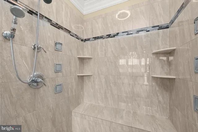 a spacious bedroom with a bed and a couch