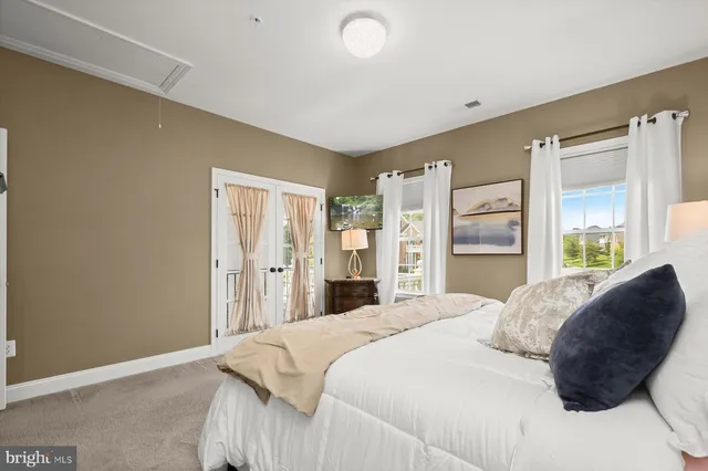 a living room with furniture and stairs