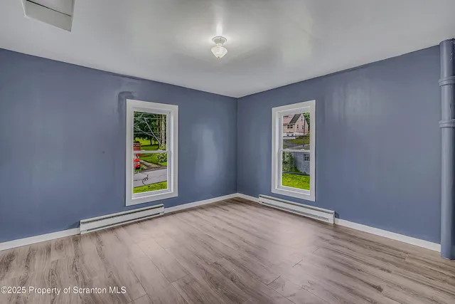 a bathroom with a toilet and bathtub