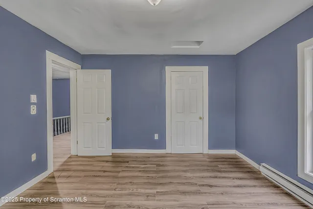 a bathroom with a sink and mirror with toilet