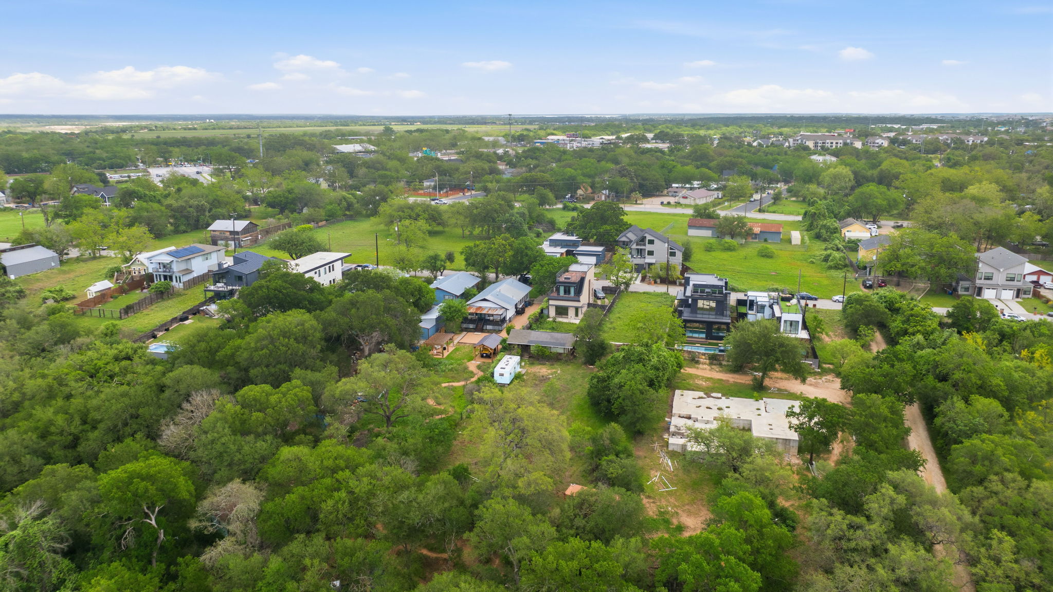 416 Kemp Street Austin, TX 78741 - Photo 10 of 14 The property is situated in a verdant setting with expansive green spaces and mature trees