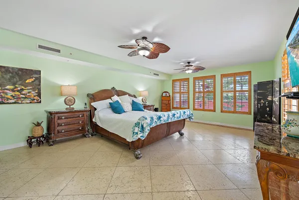 a bedroom with a bed and cabinets