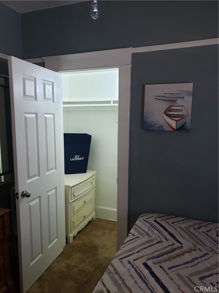 220 West 1st Street San Dimas, CA 91773 - Photo 5 of 5 a bedroom with a bed and a television