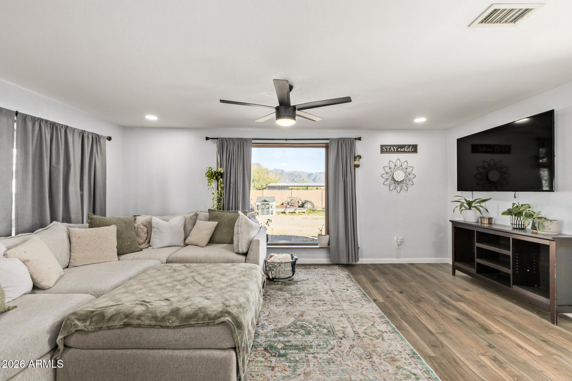 1925 East Greasewood Street Apache Junction, AZ 85119 - Photo 11 of 42 a living room with furniture and a flat screen tv