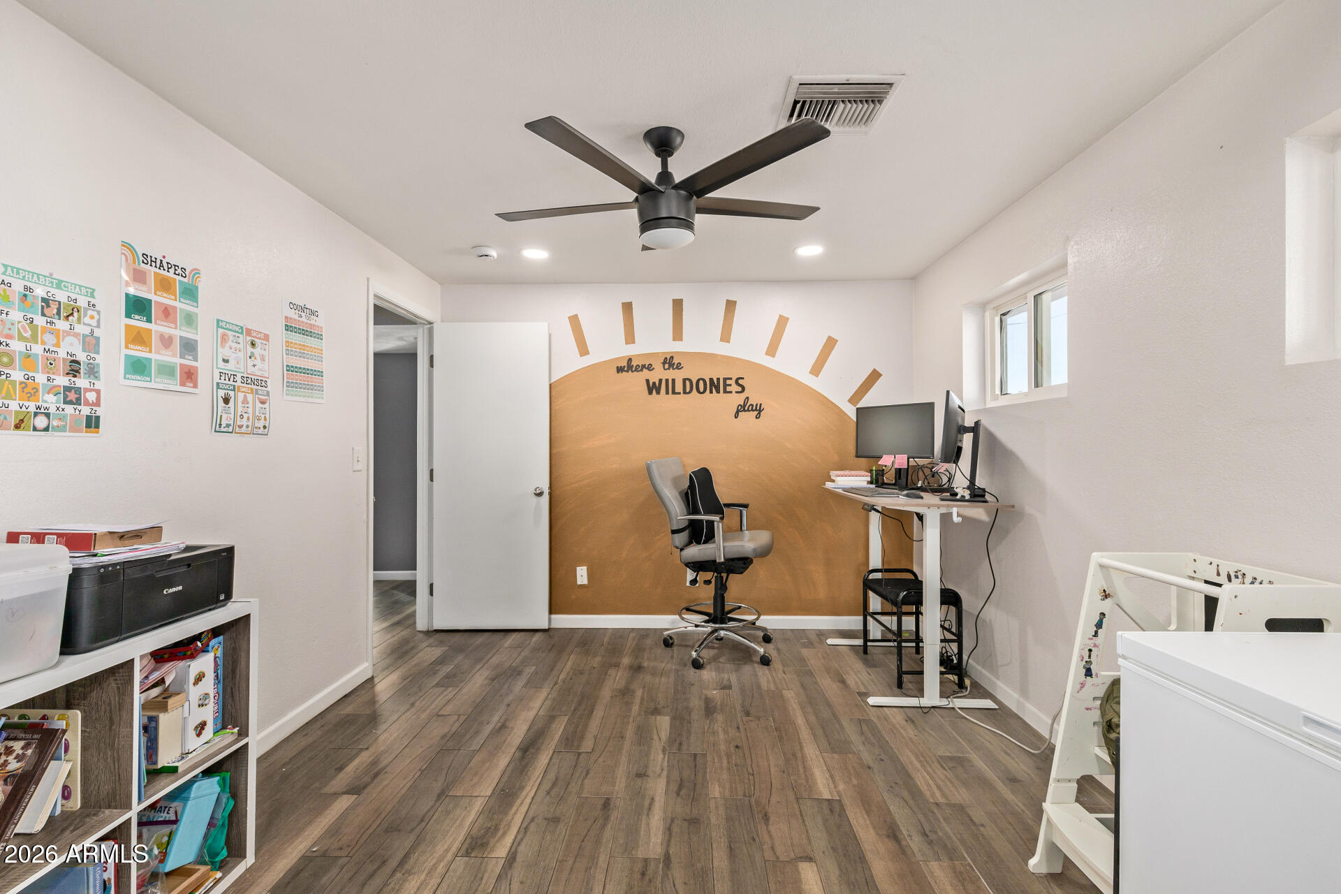 1925 East Greasewood Street Apache Junction, AZ 85119 - Photo 12 of 42 a view of a workspace with furniture and a ceiling fan