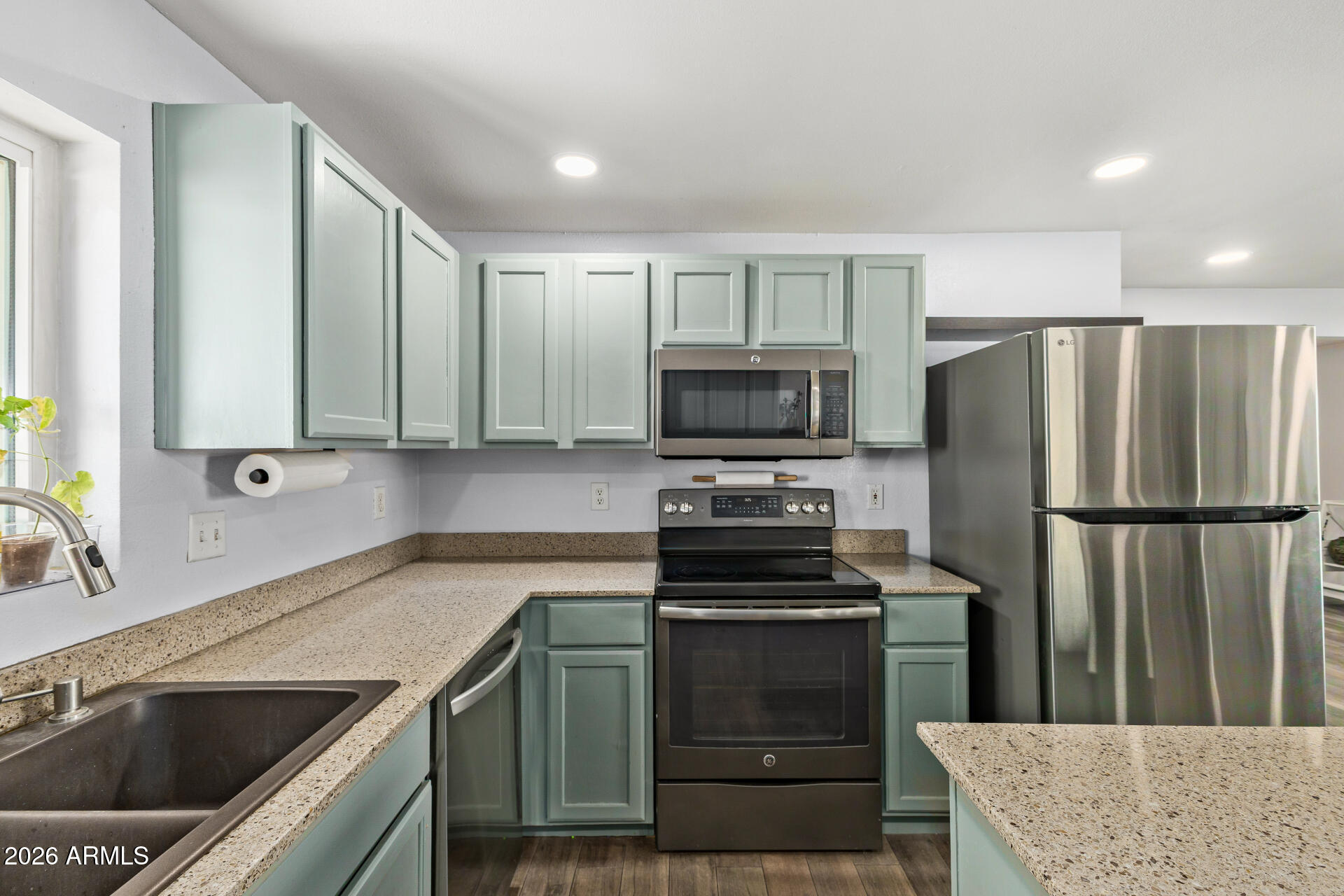 1925 East Greasewood Street Apache Junction, AZ 85119 - Photo 19 of 42 a kitchen with a refrigerator sink and microwave