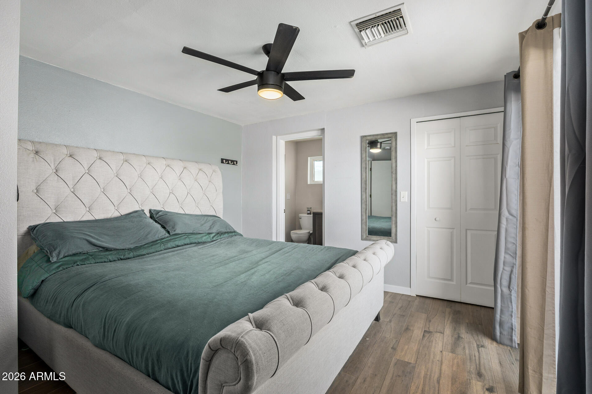 1925 East Greasewood Street Apache Junction, AZ 85119 - Photo 20 of 42 a bedroom with a bed and painting on the wall