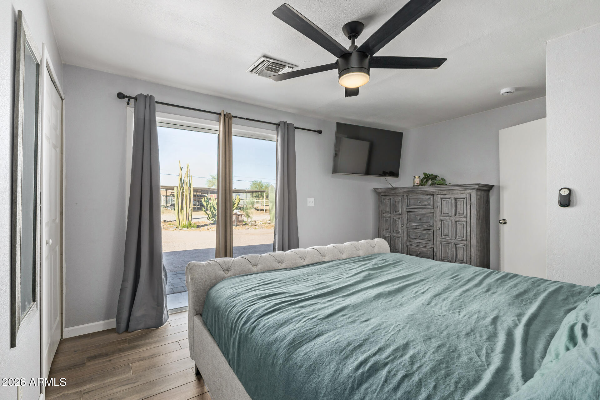 1925 East Greasewood Street Apache Junction, AZ 85119 - Photo 22 of 42 a bedroom with a large bed and a large window