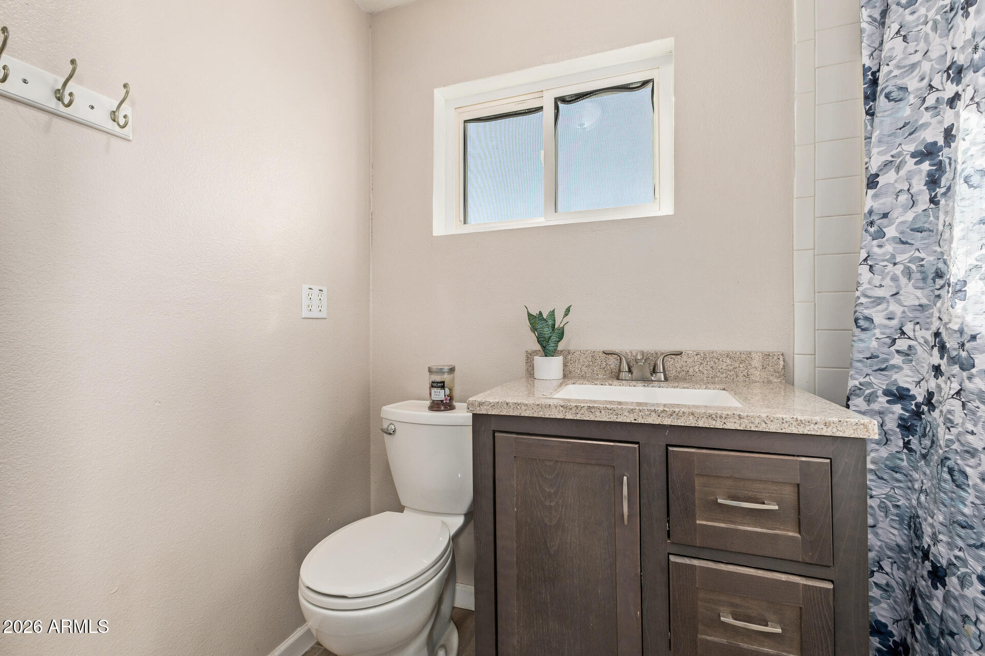1925 East Greasewood Street Apache Junction, AZ 85119 - Photo 26 of 42 a bathroom with a granite countertop toilet sink and mirror