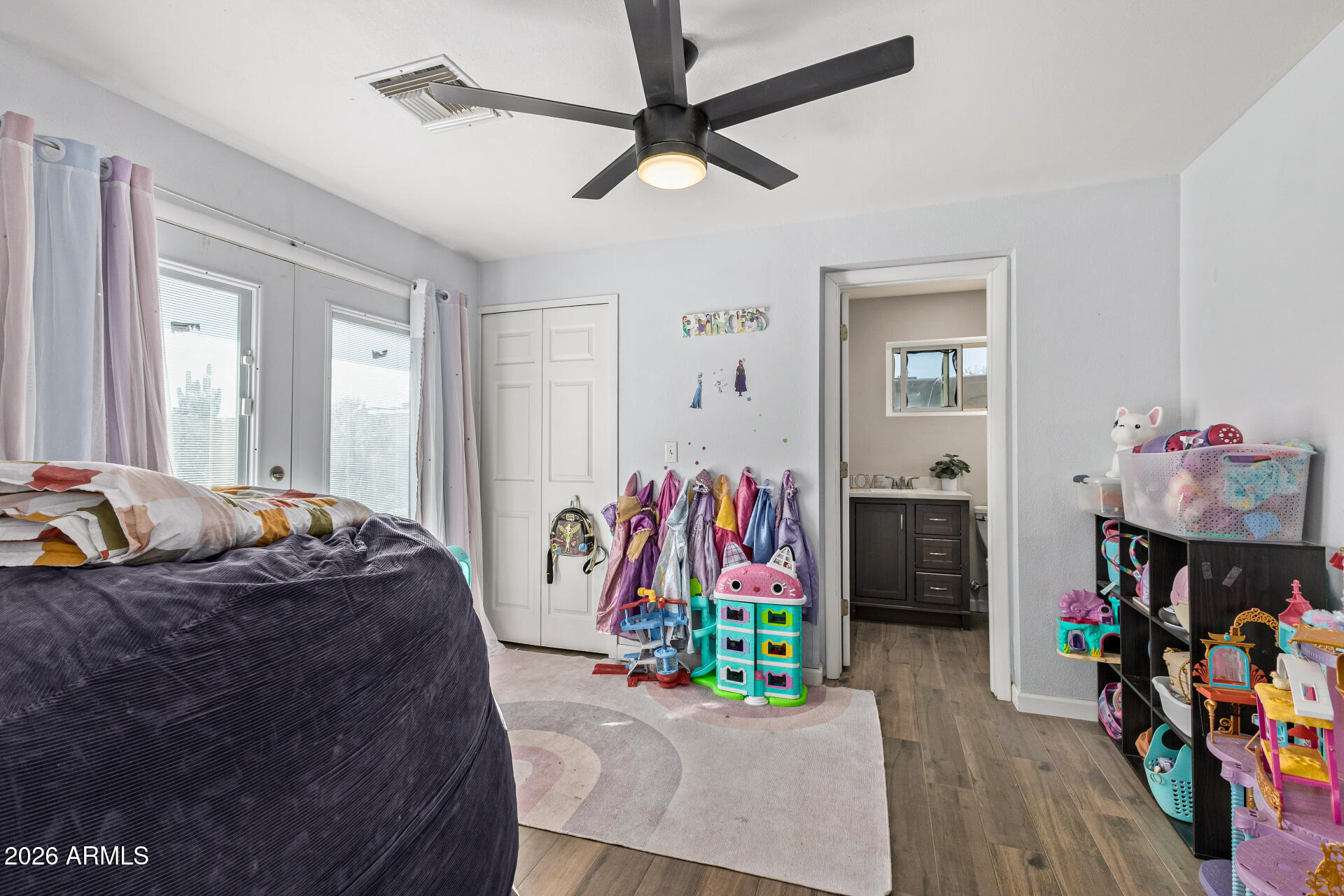 1925 East Greasewood Street Apache Junction, AZ 85119 - Photo 28 of 42 a bed room with furniture and a flat screen tv