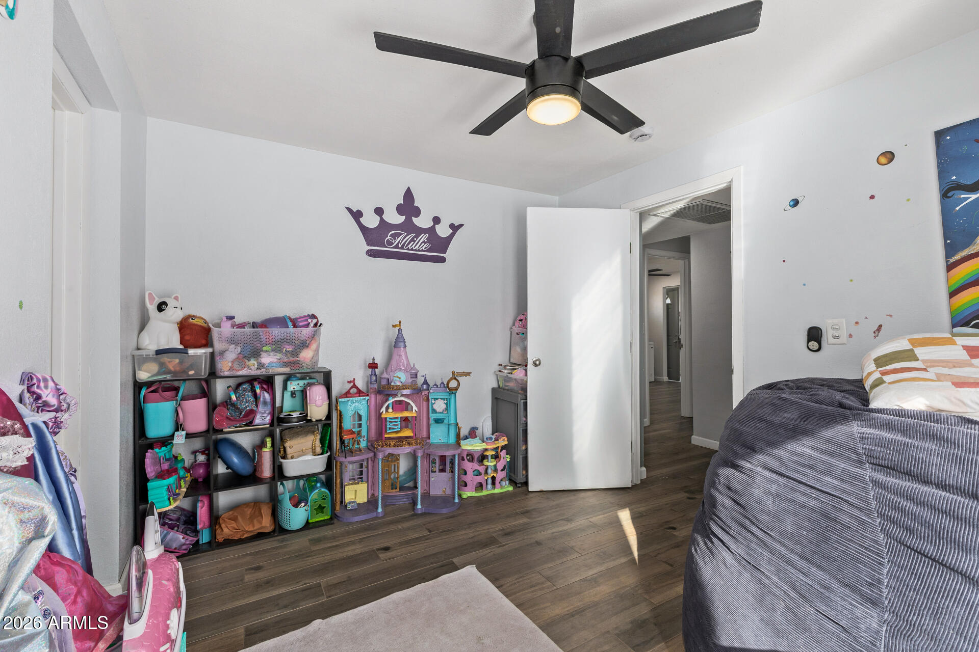 1925 East Greasewood Street Apache Junction, AZ 85119 - Photo 29 of 42 a bedroom with a bed and a chandelier