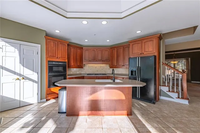a living room with furniture pool table and a window