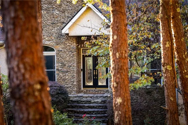 a aerial view of a house with a yard and garden