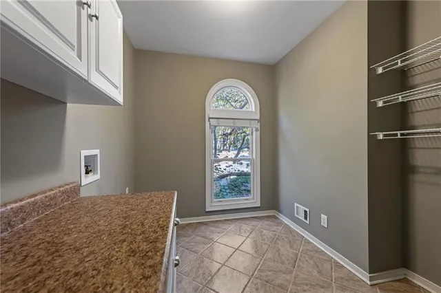 a room with furniture a table and wooden floor