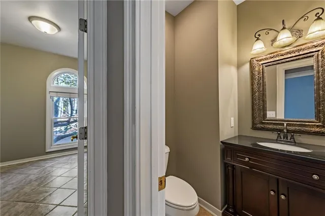 a view of a livingroom with a ceiling fan and window