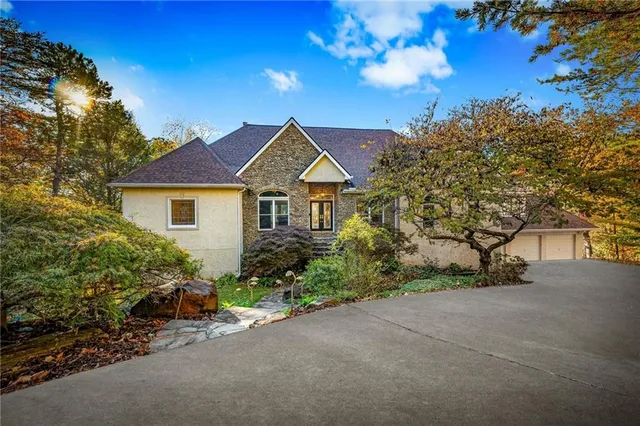a view of a livingroom with a ceiling fan and window